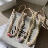 693011c612f62673a6fac5d5 Vivienne Westwood Enamel Pearl Necklace with Magnetic Clasp, Double-Sided Wear, Saturn and Crown Design, Elegant and Edgy Style