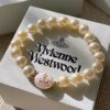 693011de12f62673a6fac5ed Vivienne Westwood Enamel Pearl Bracelet – Magnetic Clasp, Reversible Design, Six New 2023 Colors Available