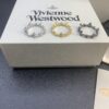 West Dame Bamboo Joint Saturn Ring in Titanium Black, Yellow Gold, and White Gold