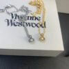 693012a612f62673a6fac6e9 West Dame Mini Pearl Saturn Necklace in Gold and Silver Two Colors