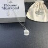 West Grandma Matte Silver and Gold Letter Logo Round Necklace in Two Tones