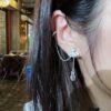 693012ef12f62673a6fac758 Vivienne Westwood Ear Studs - Punk-Inspired Fashion Statement in 925 Silver