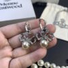 693012fb12f62673a6fac76d West Queen Bow Double-Layer Pearl Set Stud Earrings Bracelet Necklace