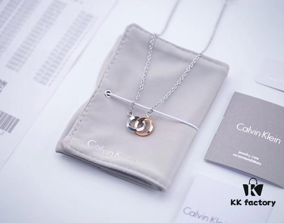 6930163812f62673a6facb70 Calvin Klein CK Double Ring Necklace, White Gold and Rose Gold Plated Couple Necklace