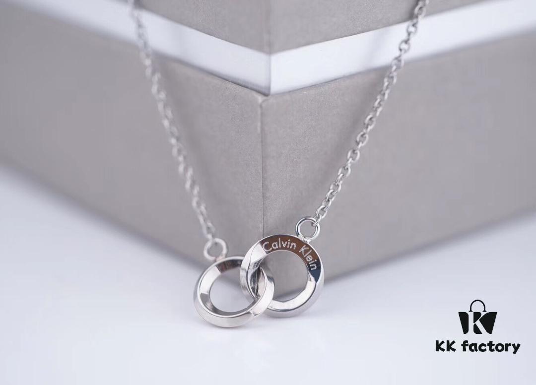 6930163f12f62673a6facb7f Calvin Klein CK Double Ring Necklace, White Gold and Rose Gold Plated Couple Necklace