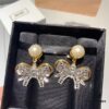 6930167e12f62673a6facbfc Miu Miu Bow Knot Stud Earrings, Guo Biting Same Style, Princess-like Charm, Dual-tone Gold-plated Craft with Swarovski Pearl