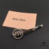 693016a712f62673a6facc34 Miu Miu Textured Luxe Love-Themed Pearl Heart Hair Clip, Minimalist Design with Vintage Charm