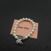 693016a912f62673a6facc36 Miumiu Elegant Heart Pearl Bracelet, Luxury Minimalist Design with Vintage Charm