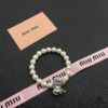 693016ab12f62673a6facc38 Miumiu Elegant Heart Pearl Bracelet, Luxury Minimalist Design with Vintage Charm