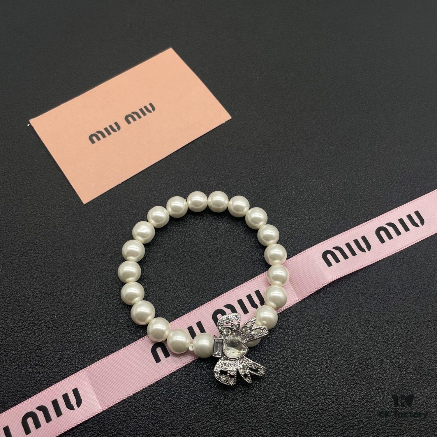 693016ab12f62673a6facc38 Miumiu Elegant Heart Pearl Bracelet, Luxury Minimalist Design with Vintage Charm