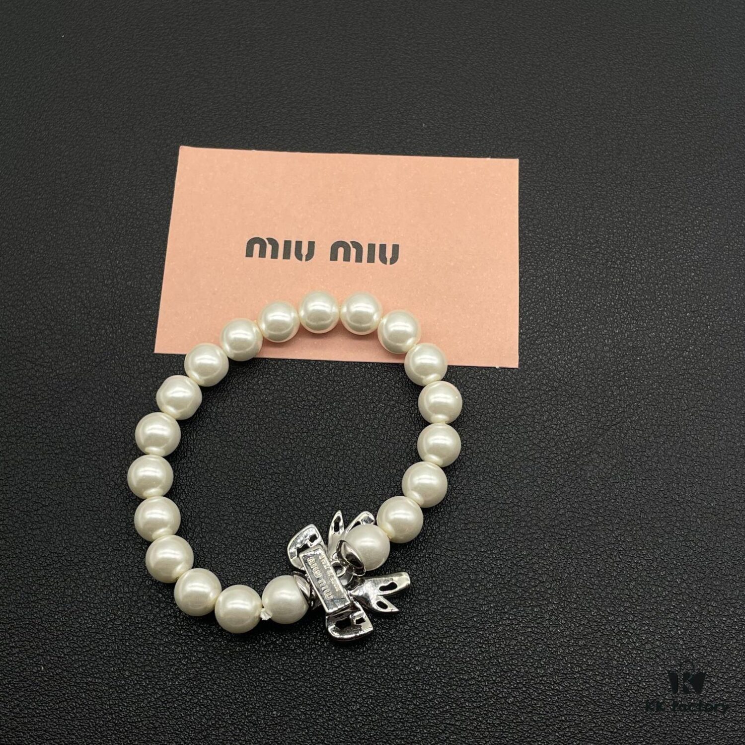 693016ac12f62673a6facc3a Miumiu Elegant Heart Pearl Bracelet, Luxury Minimalist Design with Vintage Charm