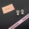 693016ee12f62673a6facc7b Miu Miu Textured Luxurious Pearl Heart Stud Earrings, Minimalist Design with Vintage Charm, Must-Have Summer Fashion Accessory