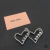 693016fc12f62673a6facc8a Miu Miu Textured Luxury Pearl Heart Stud Earrings, Minimalist Design with Vintage Charm, Must-Have Summer Fashion Accessory