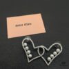 693016fc12f62673a6facc8b Miu Miu Textured Luxury Pearl Heart Stud Earrings, Minimalist Design with Vintage Charm, Must-Have Summer Fashion Accessory