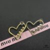 6930170b12f62673a6facc99 Miu Miu Textured Luxurious Pearl Heart Stud Earrings, Minimalist Design with Vintage Charm, Must-Have Summer Fashion Accessory