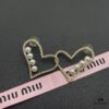 6930170f12f62673a6facc9c Miu Miu Textured Luxurious Pearl Heart Stud Earrings, Minimalist Design with Vintage Charm, Must-Have Summer Fashion Accessory