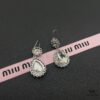 6930171312f62673a6facca3 Miu Miu Textured Luxurious Pearl Heart Stud Earrings, Minimalist Design with Vintage Charm