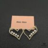 6930171312f62673a6facca4 Miu Miu Textured Luxurious Pearl Heart Stud Earrings, Minimalist Design with Vintage Charm, Must-Have Summer Fashion Accessory