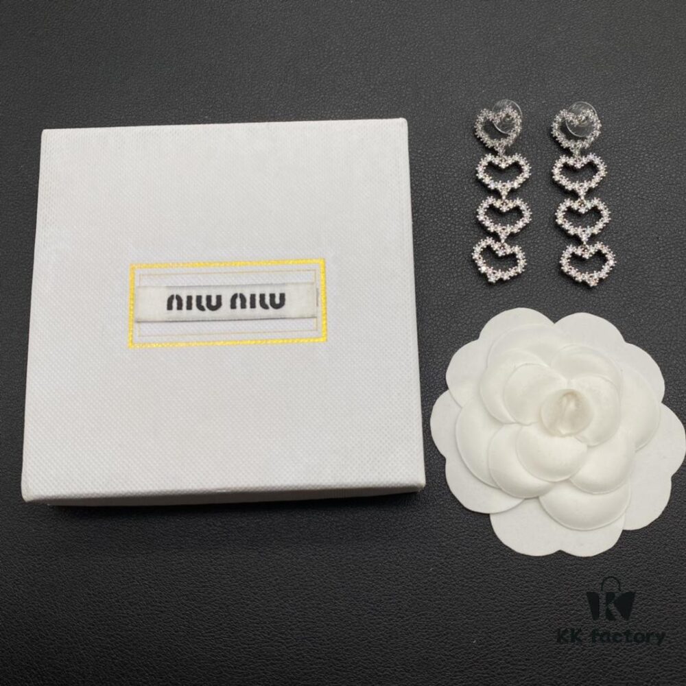 6930175812f62673a6faccfa Miu Miu Textured Luxe Minimalist Pearl Heart Stud Earrings