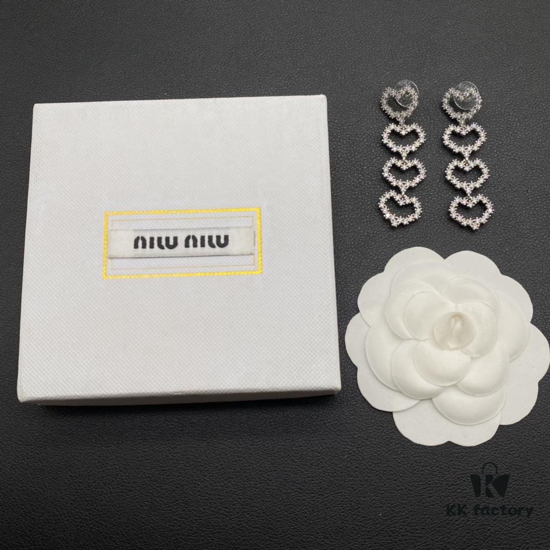 6930175812f62673a6faccfa Miu Miu Textured Luxe Minimalist Pearl Heart Stud Earrings