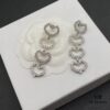 6930175a12f62673a6faccfd Miu Miu Textured Luxe Minimalist Pearl Heart Stud Earrings