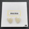 6930175d12f62673a6facd02 Miu Miu Textured Luxury Pearl Heart Stud Earrings, Minimalist Design with Vintage Charm, Must-Have Summer Fashion Accessory
