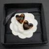 6930176212f62673a6facd07 Miu Miu Textured Luxurious Pearl Heart Stud Earrings, Minimalist Design with Vintage Charm, Must-Have Summer Fashion Accessory