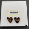 6930176d12f62673a6facd13 Miu Miu Textured Luxurious Pearl Heart Stud Earrings, Minimalist Design with Vintage Charm, Must-Have Summer Fashion Accessory