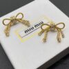 6930177c12f62673a6facd27 Miu Miu Textured Luxury Pearl Heart Stud Earrings, Minimalist Design with Retro Charm