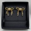 6930177c12f62673a6facd28 Miu Miu Textured Luxury Pearl Heart Stud Earrings, Minimalist Design with Retro Charm