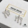 6930178312f62673a6facd34 Miu Miu Textured Luxurious Pearl Heart Stud Earrings, Minimalist Design with Vintage Charm, Must-Have Summer Fashion Accessory