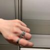 6930181c12f62673a6face39 Platinum-colored Piaget ring with rotating design, featuring single diamond, seven-diamond, and full-diamond options