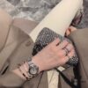 6930181c12f62673a6face3a Platinum-colored Piaget ring with rotating design, featuring single diamond, seven-diamond, and full-diamond options
