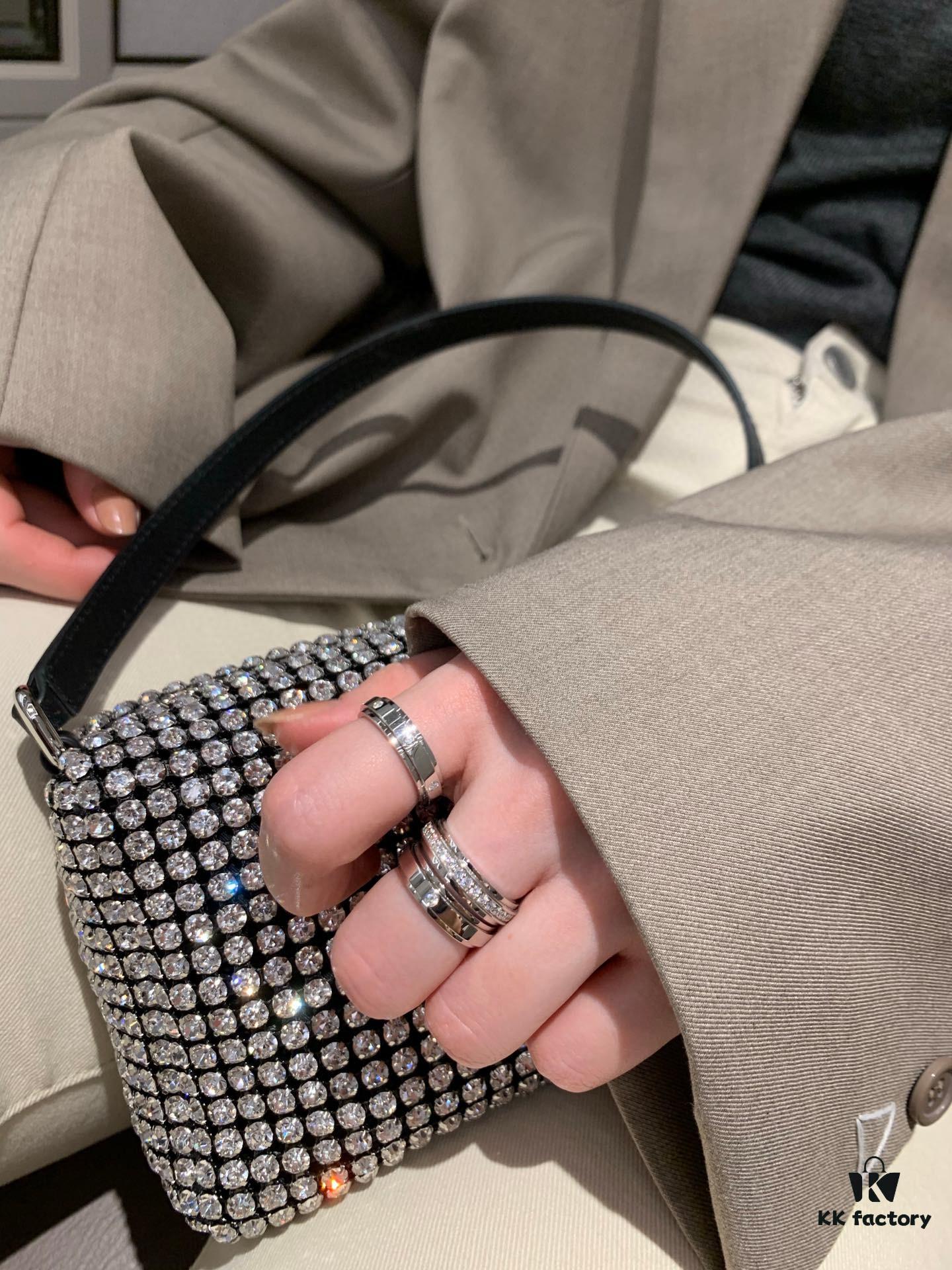 6930181d12f62673a6face3b Platinum-colored Piaget ring with rotating design, featuring single diamond, seven-diamond, and full-diamond options