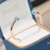 6930185a12f62673a6faceae Piaget Possession Series Bracelet with Rotating Design and Gemstone Accents