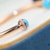 6930185d12f62673a6faceb2 Piaget Possession Series Bracelet with Rotating Design and Gemstone Accents