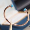 6930185e12f62673a6faceb4 Piaget Possession Series Bracelet with Rotating Design and Gemstone Accents