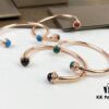 693018d412f62673a6facf55 Piaget Possession Bracelet in Rose Gold with Rotating Circle Set with Two Cabochon Stones and Pavé Diamonds