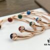 693018d512f62673a6facf57 Piaget Possession Bracelet in Rose Gold with Rotating Circle Set with Two Cabochon Stones and Pavé Diamonds