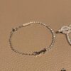 693019cc12f62673a6fad07c YSL Saint Laurent Half-Paved Bracelet & Hermès Pig Nose Fully Paved Diamond Bracelet