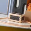69301ff612f62673a6fad6ef Top-Quality Replica Dynamic Chip Dual-Color Leather Mini Square Trunk M13127 M14040