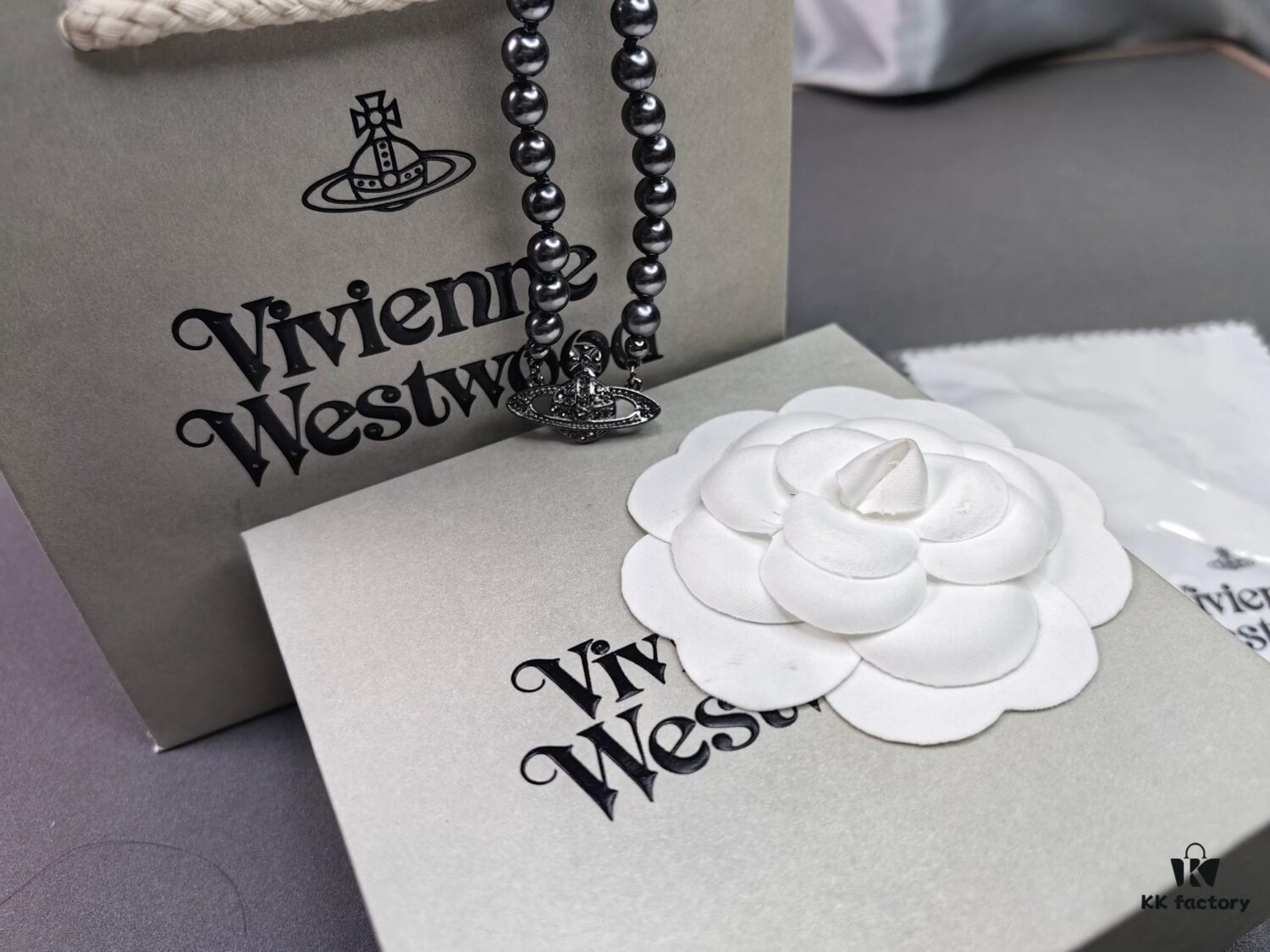 693036d9f09edb6de4c4ccf6 Vivienne Westwood Black Gun Color Saturn Pearl Necklace