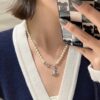 693036e1f09edb6de4c4cd00 Vivienne Westwood - Pin Planet Necklace
