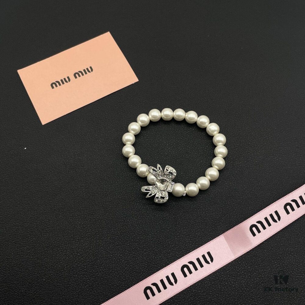69303712f09edb6de4c4cd2d Miumiu Elegant Heart Pearl Bracelet, Luxury Minimalist Design with Vintage Charm