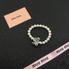 69303712f09edb6de4c4cd2d Miumiu Elegant Heart Pearl Bracelet, Luxury Minimalist Design with Vintage Charm
