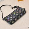 69303909f09edb6de4c4cf16 M13404 Black and White Coated Canvas Pochette Accessoires Bag