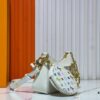 69303a68f09edb6de4c4d0b2 M13099 Marellini Handbag crafted from textured Epi leather with a compact silhouette, offering ample space for daily essentials like a smartphone. Features a round coin purse and mirror made from the vibrant Monogram canvas of the Louis Vuitton × Takashi Murakami collaboration, attached to the bag via a bold metal chain. Dimensions: 19x13.5x6.5cm