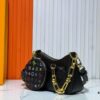 69303aa0f09edb6de4c4d10e M13099 Marellini Handbag crafted from textured Epi leather with a compact silhouette and ample space for daily essentials like a smartphone