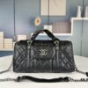 693041f2f09edb6de4c4d94e New Arrival Vintage Chanel Boston Bag in Black and Gold – Absolutely Collector-Level Cute!