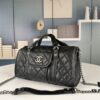 69304215f09edb6de4c4d971 New Arrival Vintage Chanel Boston Bag in Black and Gold – Absolutely Collector-Level Cute!